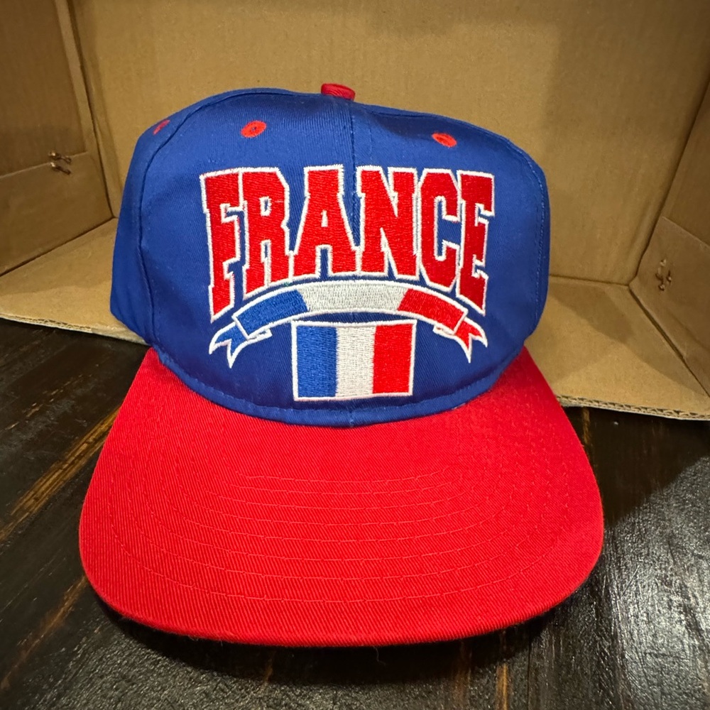 Blue and Red France Cap. Snap back one size.